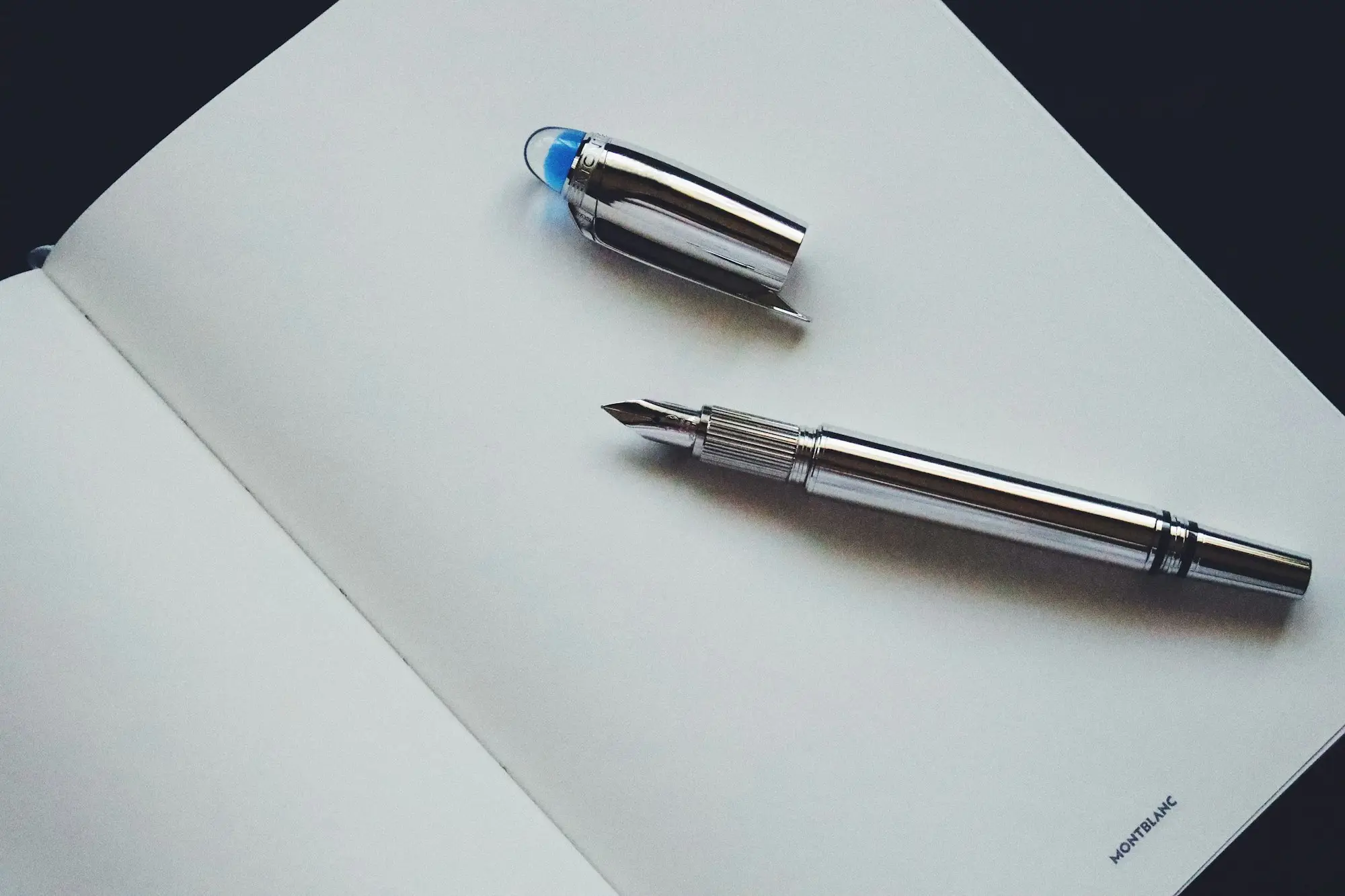A pen resting on a blank sheet of paper